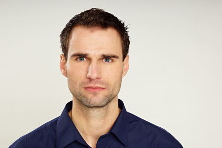 Portrait of handsome man in dark blue shirt, right you caan write some text