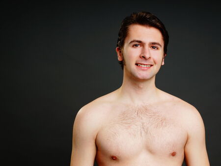 Portrait of young man without shirt, left you can write some textの写真素材