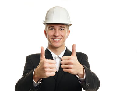 Young businessman in a protective helmet show you thumbs up