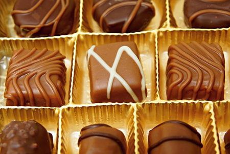 Various and tasty chocolates candies in a boxの写真素材