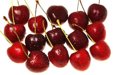 red cherries with dew on white background