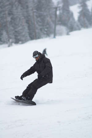 Snowboarder in big snowfallの写真素材