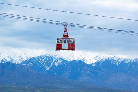 Cable railway and high mountainの写真素材