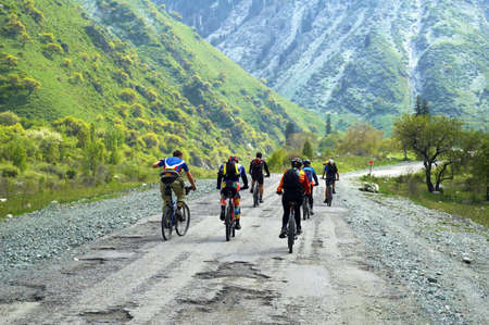 Group of the bikers on bad mountain roadの写真素材
