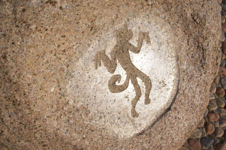 Monkey - primitive art draving on stoneの写真素材