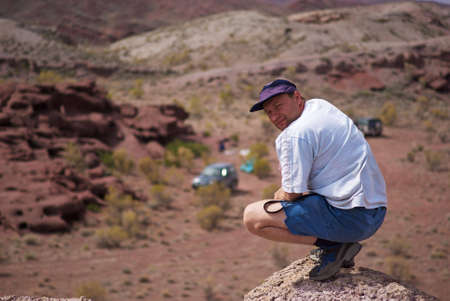 Man walking in the desert mountains