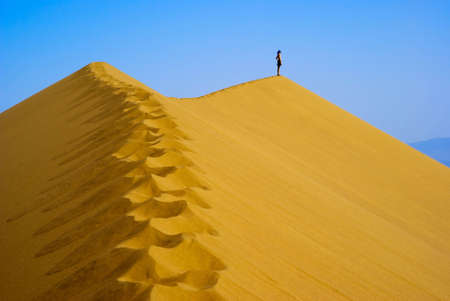 Man on top Sand Duneの写真素材