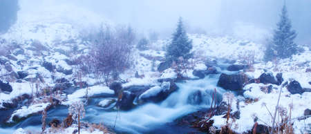 Fog in winter mountains panoramicの写真素材