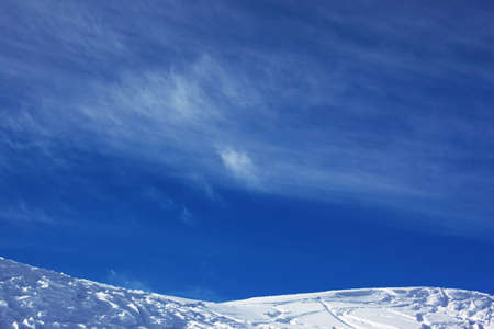 Mountain resort slope and skyの写真素材