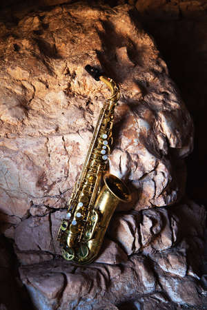 Saxophone and old rockの写真素材