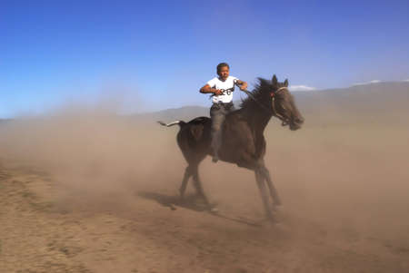 LEPSINSK, KAZAKHSTAN - JUNE 14 : A traditional national nomad long-distance horse riding competition Bayga in action on June 14, 2008 in Lepsinsk, Kazakhstan.のeditorial素材