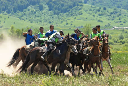 LEPSINSK, KAZAKHSTAN - JUNE 14 : A traditional nomad game of Kokpar in action on June 14, 2008 in Lepsinsk, Kazakhstan. Kokpar is played on horseback to carry dead goat carcass into a goal.のeditorial素材