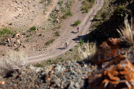 ALMATY, KAZAKHSTAN - SEPTEMBER 13: Kirill Kazantcev (N32) and Evgeny Kazantcev (N2)  in action at Adventure mountain bike cross-country marathon "Marathon Bartogay-Assy-Batan 2009" September 13, 2009 in Almaty, Kazakhstan.のeditorial素材