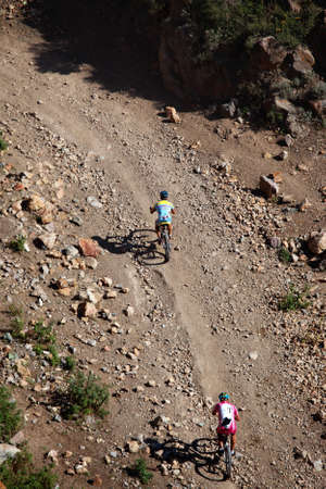ALMATY, KAZAKHSTAN - SEPTEMBER 13: Kirill Kazantcev (first) and Evgeny Kazantcev  in action at Adventure mountain bike cross-country marathon "Marathon Bartogay-Assy-Batan 2009" September 13, 2009 in Almaty, Kazakhstan.のeditorial素材