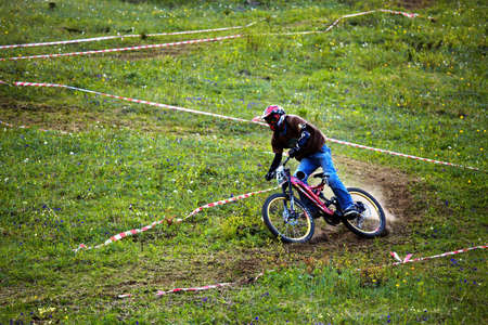 ALMATY, KAZAKSTAN - JUNE 21: Rodion Sagatinov (N28) in action at CITY CHAMPIONSHIP ALMATY MOUNTAIN BIKE DOWNHILL in Almaty, Kazakstan June 21, 2009.のeditorial素材