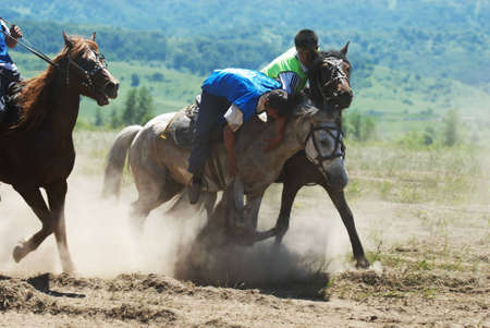 LEPSINSK, KAZAKHSTAN - JUNE 14 : A traditional nomad game of Kokpar in action on June 14, 2008 in Lepsinsk, Kazakhstan. Kokpar is played on horseback to carry dead goat carcass into a goal.のeditorial素材