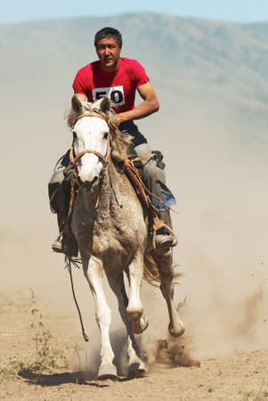 LEPSINSK, KAZAKHSTAN - JUNE 14 : A traditional national nomad long-distance horse riding competition Bayga in action on June 14, 2008 in Lepsinsk, Kazakhstan.のeditorial素材