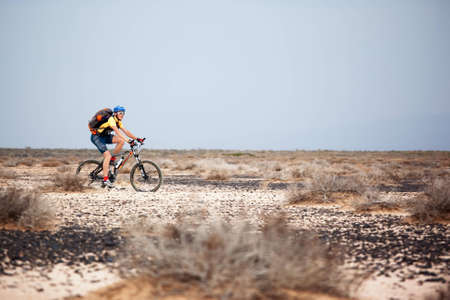 ALMATY, KAZAKHSTAN - MAY 1: V.Kochetov (N26) in action at Adventure mountain bike marathon in desert "Jeyran Trophy 09" May 1, 2009 in Almaty, Kazakhstan.のeditorial素材