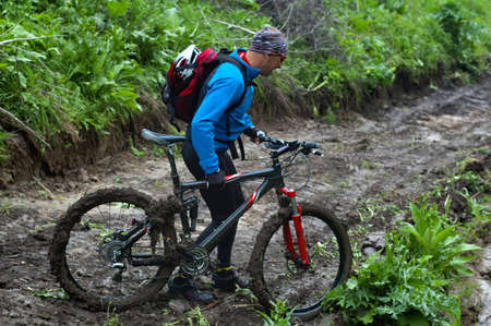 Mountain biker and mud terrainの写真素材