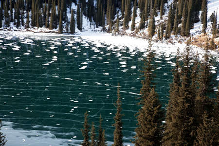 Frozen middle Kolsay lake in Tien-Shan mountains, Kazkahstanの写真素材