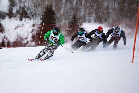 ALMATY, KAZAKHSTAN - January 8: Alexandr Dyadchik (N07) in action at Ski and Boarder Cross competition on Ski Resort Akbulak, January 8, 2011 in Almaty, Kazakhstan.のeditorial素材