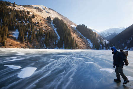 Snow blizzard frozen middle Kolsay lake in Tien-Shan mountains, Kazkahstanの写真素材