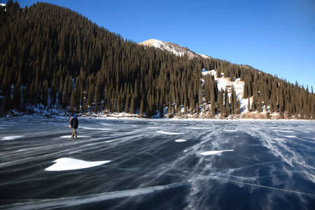Snow blizzard frozen middle Kolsay lake in Tien-Shan mountains, Kazkahstanの写真素材