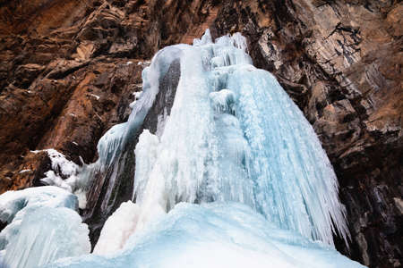 Frozen waterfall and rocksの写真素材