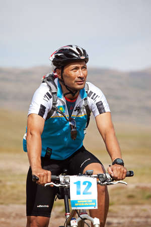ALMATY, KAZAKHSTAN - SEPTEMBER 13: Timur Jurkashev (N12) in action at Adventure mountain bike cross-country marathon in mountains "Marathon Bartogay-Assy-Batan 2009"  September 13, 2009 in Almaty, Kazakhstan.のeditorial素材