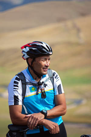 ALMATY, KAZAKHSTAN - SEPTEMBER 13: Timur Jurkashev (N12) in action at Adventure mountain bike cross-country marathon in mountains "Marathon Bartogay-Assy-Batan 2009"  September 13, 2009 in Almaty, Kazakhstan.のeditorial素材