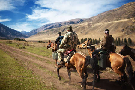 Horseback Riding in the Kazkahstan mountainの写真素材