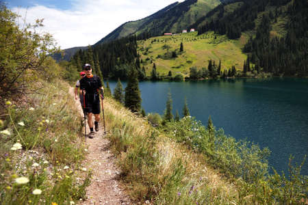 Two mans on the trail along Kolsai lake, Kazakhstanの写真素材