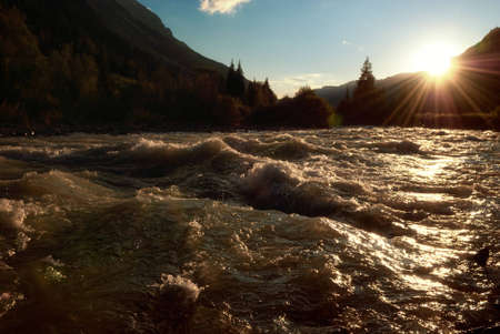 Sunset on river Kara in the mountains Dzungarian Alatau, Kazakhstanの写真素材
