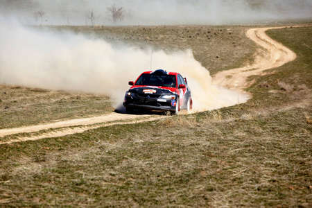 ALMATY, KAZAKHSTAN - APRIL 9: Kazanovsky and Li (2) in action at auto competition "Rally Borly" April 9, 2011 in Almaty, Kazakhstan.のeditorial素材