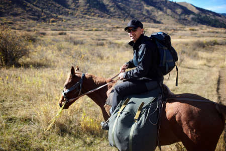 Horseback Riding in the Kazkahstan mountainの写真素材