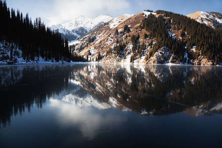 Frozen middle Kolsay lake in Tien-Shan mountains, Kazakhstanの写真素材