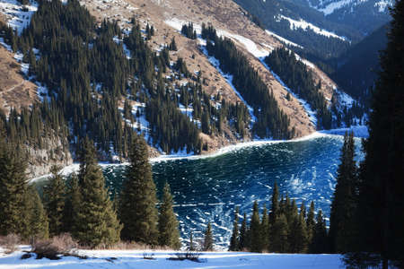Frozen middle Kolsay lake in Tien-Shan mountains, Kazakhstanの写真素材