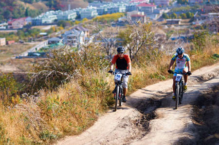 ALMATY, KAZAKHSTAN - OCTOBER 16: P.Fedurin(N65) in action at cross-country mountain bike 'Apple race' October 16, 2011 in Almaty , Kazakhstan.のeditorial素材