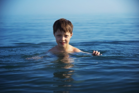 Boy swimming in the seaの写真素材