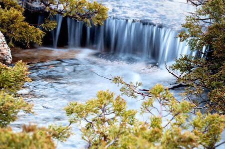 Small waterfall and juniper branches