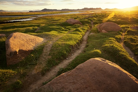Footpath and sunrise in the valley of Khovd river, Western Mongoliaの写真素材