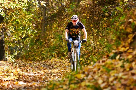 ALMATY REGION, KAZAKHSTAN - OCTOBER 13: V.Kachanov (N164) in action at mountain bike sports event...