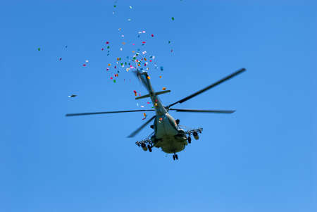 LEPSINSK, ALMATY REGION, KAZAKHSTAN - JUL 14, 2008: Military helicopter throws festive flyersのeditorial素材