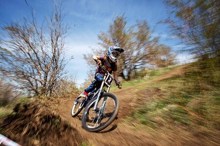 ALMATY, KAZAKSTAN - APRIL 27, 2014: Unknown rider in action at Mountain Bike sports event Downhill Koktybe. のeditorial素材