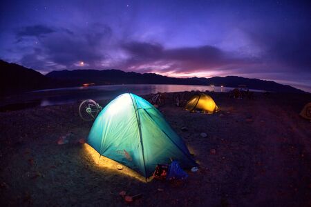 ALMATY, KAZAKSTAN - MAY 01, 2014: Night camp of Adventure mountain bike cross-country marathon in mountains "Jeyran Trophy 2014" beside Bartogay lakeのeditorial素材