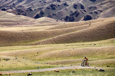 ALMATY, KAZAKSTAN - MAY 03, 2014: K.Kazantchev (N1) in action at Adventure mountain bike cross-country marathon in mountains "Jeyran Trophy 2014" のeditorial素材