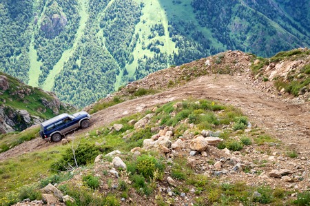 ALMATY REGION, KAZAKSTAN - JULE 08, 2014: Jeep climb from the Kora gorge in Dzungarian Alatau on a dangerous dirt road.のeditorial素材