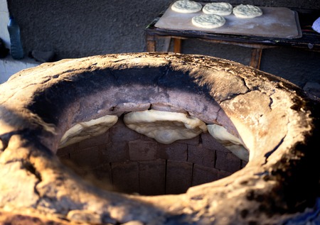 Process cooking flat bread in the tandoor oven