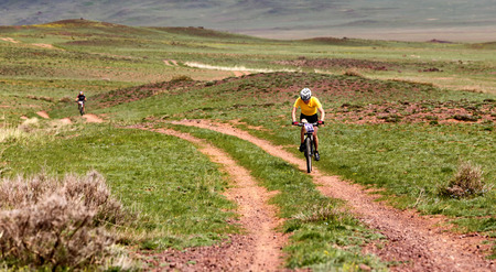 ALMATY, KAZAKHSTAN - MAY 1, 2015: N.Eleusizov (N13) in action at Adventure mountain bike marathon "Jeyran Trophy 2015"のeditorial素材