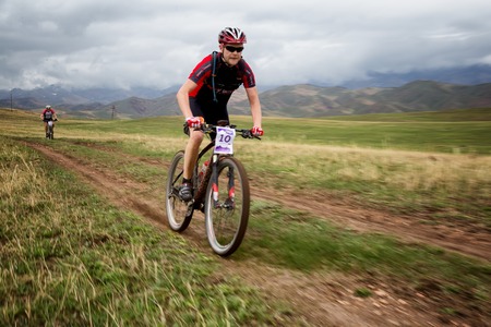 ALMATY, KAZAKSTAN - MAY 02, 2015: A.Kovalgonov (N10) in action at Adventure mountain bike...